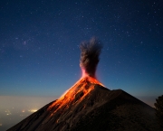 After reaching base camp on Volcano Acatenango, we fell asleep. Only to be awoken by adjacent active Volcano Fuego putting on a show. Taken under a nearly full moon in Guatemala around 1:30am.